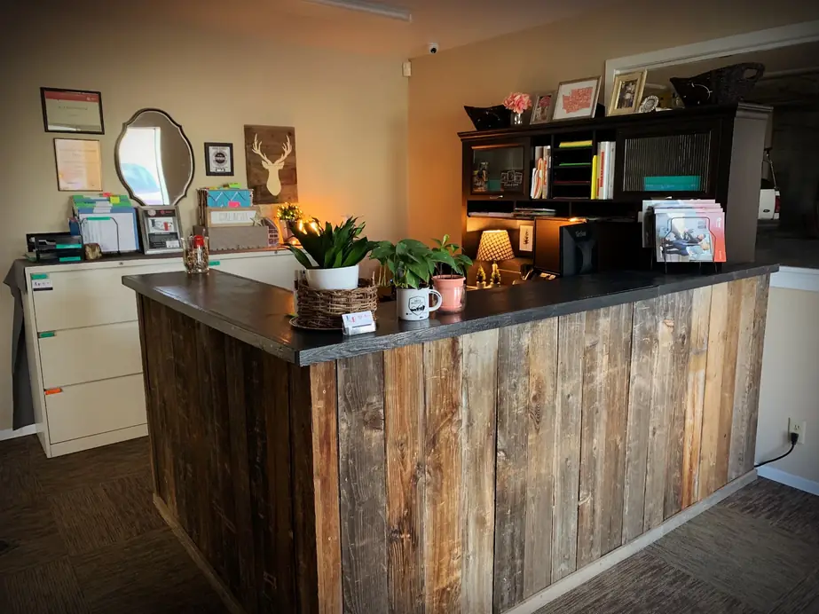 The reclaimed barn-wood front counter at the Ice & Fire Mechanical office